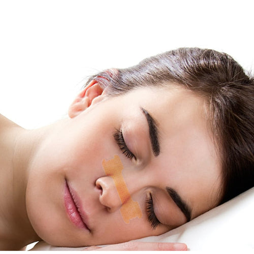 A nasal strip worn across the bridge of the nose during sleep